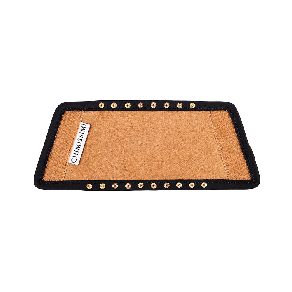 Australian designer slides back of tan upper made with black velvet lining, studs, and velcro.